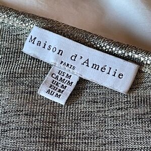 Maison d’Amelie silver one-shoulder top.